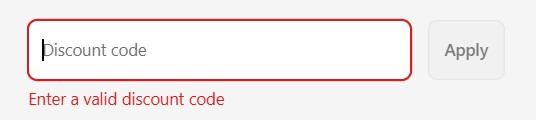 Shopify checkout page showing a discount code entered with a warning icon, indicating the discount isn’t applying correctly.